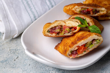 Turkish Pacanga Boregi with pastirma (pastrami) and cheddar (melted) cheese. - Pastirmali Borek