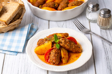 Traditional Homemade Turkish Food Kofte - Kofta with Tomato Sauce and Potatoes. (Turkish name; Izmir kofte)