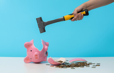 Crush the piggy bank with a hammer