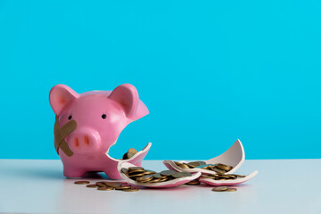 Broken piggy bank on the table
