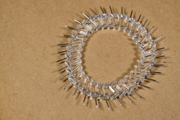 thumb tacks arranged in circular pattern