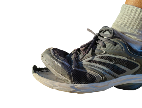 side view of torn shoes, shoes in need of repair on a transparent background