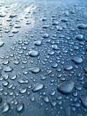 close up drops of water on a car