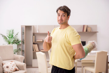 Young man doing housework indoors