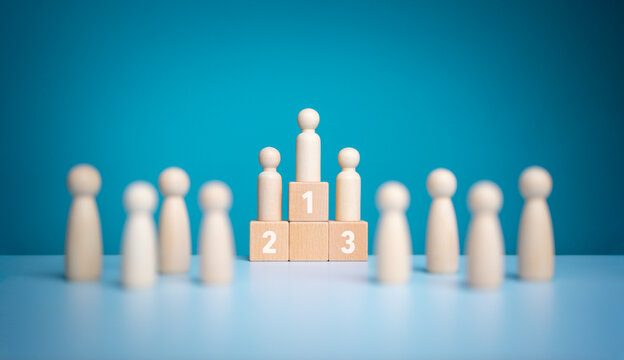 Business hierarchy, Wooden figures peg dolls standing on the podium 1st, 2nd, and 3rd positions of wooden cube blocks with copy space. Ranking and strategy concept. Success or ranking ideas.