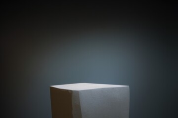 3d rendered white pedestal on dark background with spotlight, podium for product, stage