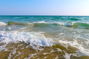 Beach with wave and blue sea water background