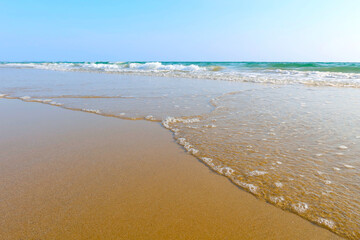 Fototapeta premium Beach with wave and blue sea water background