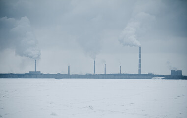 From the pipes of a metallurgical plant against the sky. Production.