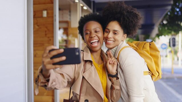 Black woman, friends and selfie in city with smile, peace sign or funny face for kiss, tongue and outdoor. Girl, women and street in metro for social media, photography or profile picture on sidewalk
