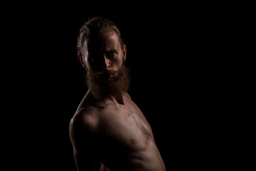 Portrait of bearded guy in studio photo. Expression and fashion