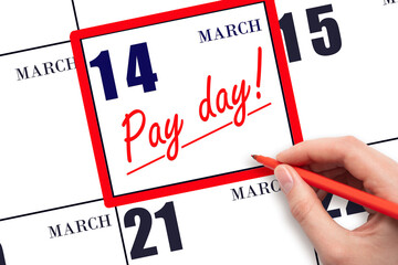 Hand writing text PAY DATE on calendar date March 14 and underline it. Payment due date