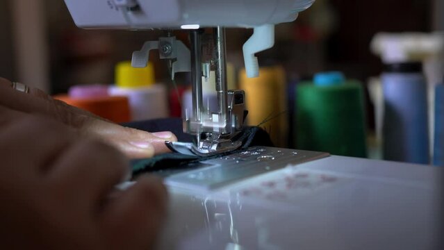 person working on sewing machine