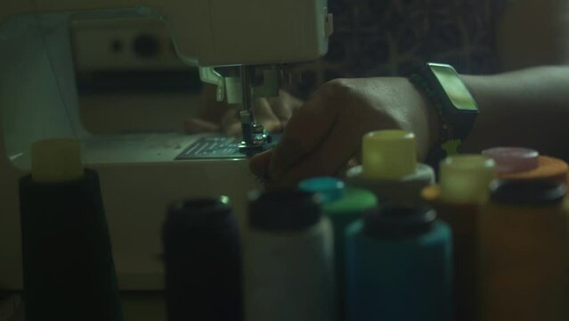 dressmaker in sewing workshop