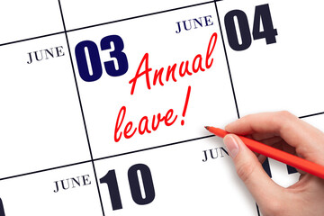 Hand writing the text ANNUAL LEAVE and drawing the sun on the calendar date June 3