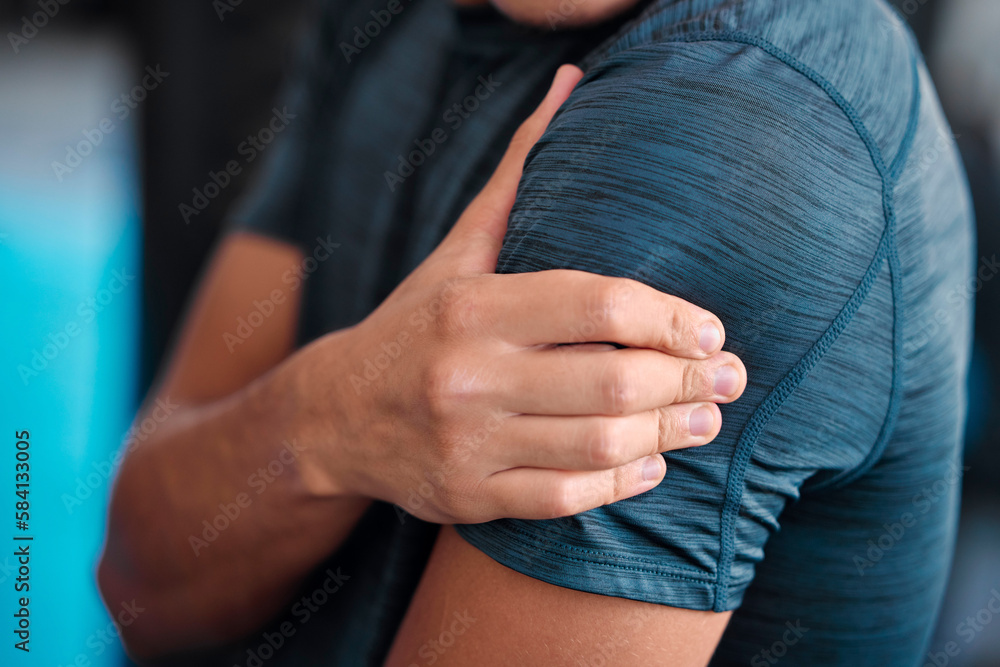 Poster Hand, shoulder and injury with a sports man holding a joint in pain while training in a gym for health. Fitness, accident or anatomy with a male athlete suffering from an injured body during exercise