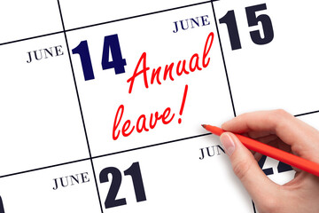 Hand writing the text ANNUAL LEAVE and drawing the sun on the calendar date June 14