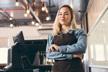Portrait Beautiful caucasian barista with coffee machine in coffee shop