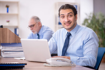 Two male colleagues working in the office