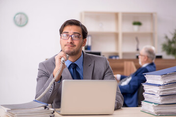 Two male colleagues working in the office