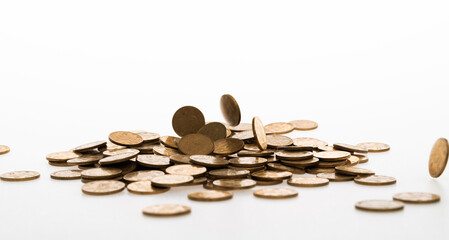 Golden coins falling on white background