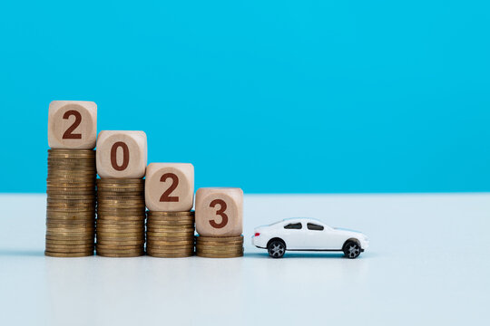 New year 2023, coins and car model