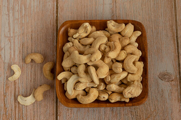 Cashew nuts on a rectangular wooden plate