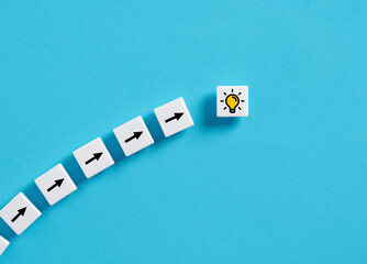 Achieving a creative idea. Generating an idea. Brainstorming and teamwork. Arrow and light bulb...