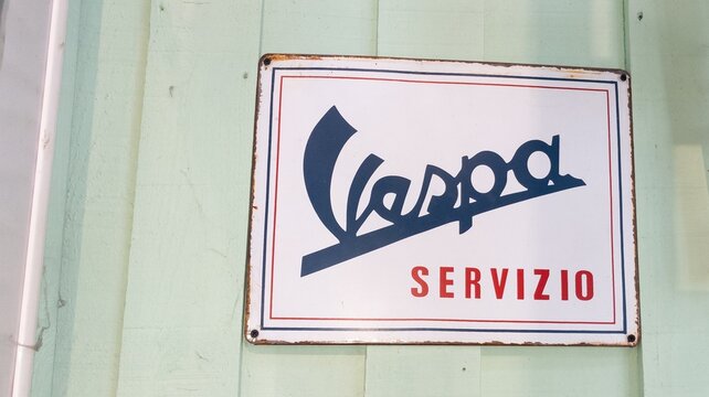 vespa servizio old logo brand and ancient text sign on panel service piaggio scooter