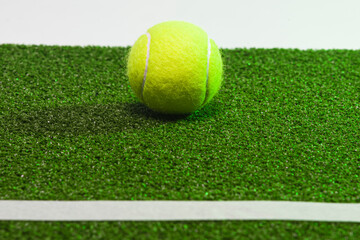 Sport Ideas. Variety of Tennis balls on green artificial grass surface
