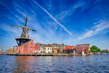 Picturesque View of Harlem Sight With De Adriaan Windmill on Spaarne River On The Background At Noon.
