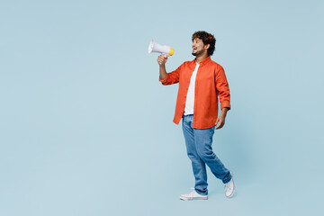 Full body young fun Indian man wear orange red shirt white t-shirt hold in hand megaphone scream...