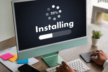 man installing Software Update On Mobile Phone And Laptop digital technology communication