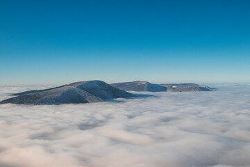 Mountainsides of the Beskydy region in the Czech Republic are sinking into a thick white inversion...