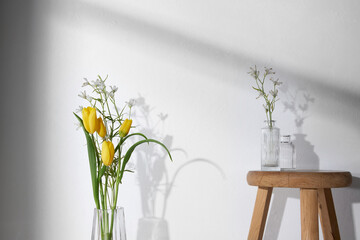 A cozy home with sunlight shining through the
windows and fresh flowers