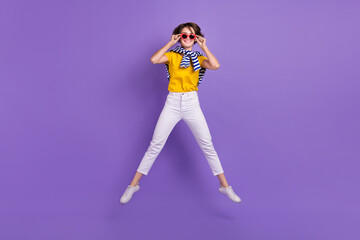 Fototapeta na wymiar Full length photo of positive cheerful lady wear comfort bright clothes good mood have fun cool party isolated on purple color background