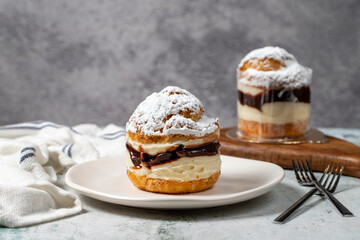 Cake with cream and liquid chocolate filling. Powdered Sugar Cake.