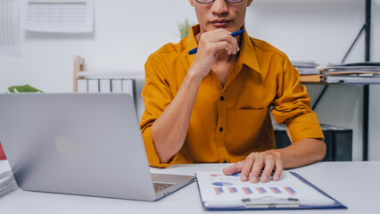 Young Serious asia people bookkeeper doing bookkeeping entrepreneur small business owner accountant...