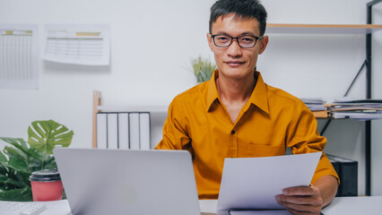 Young Serious asia people bookkeeper doing bookkeeping entrepreneur small business owner accountant...