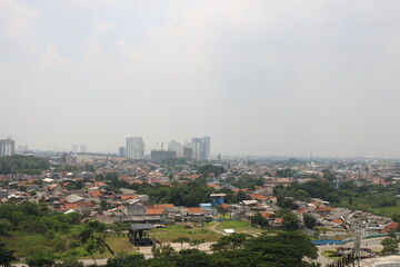 View of tall buildings, seen from the rooftop.