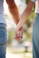 Back of couple holding hands in park for love, date or marriage commitment together in garden....