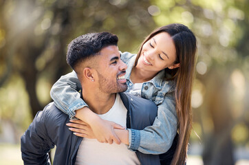Fototapeta premium Couple, smile and outdoor on piggyback for love, care and happiness together in summer. Young man and woman at nature park for a moment on a happy and romantic date or vacation to relax