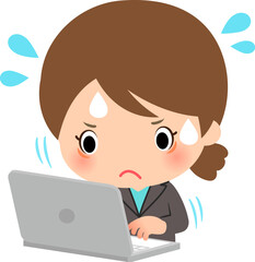 忙しそうにパソコン作業をするスーツの女性