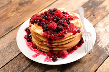 stack of pancakes with berries fruits