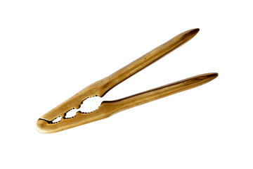 Closed antique brass nutcracker on white background