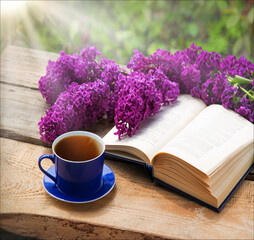Still life from ancient book and lush boquet