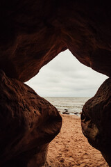 Latvian natural scenery, sand cliffs and caves near the beach of the Gulf of Riga