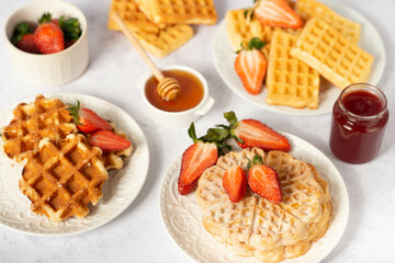 different shapes Belgian waffles with strawberries
