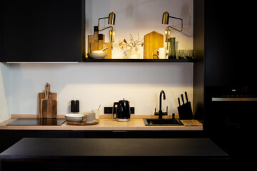 The interior of a modern kitchen is black.