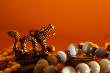 Dragon figurine and jewelry. Religious and spiritual symbol.